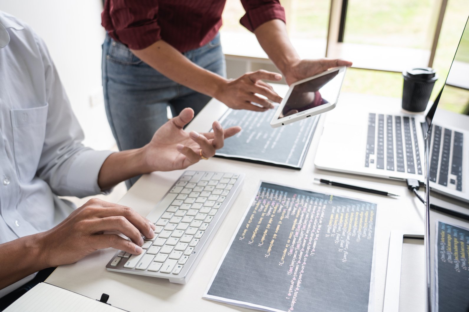 Young Startup Programmers Sitting at Desks Working on Computers